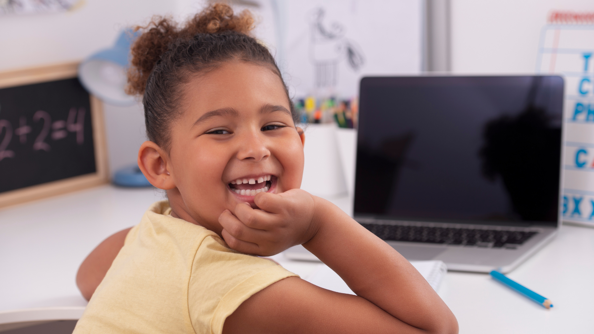 Young black female homeschooler on laptop