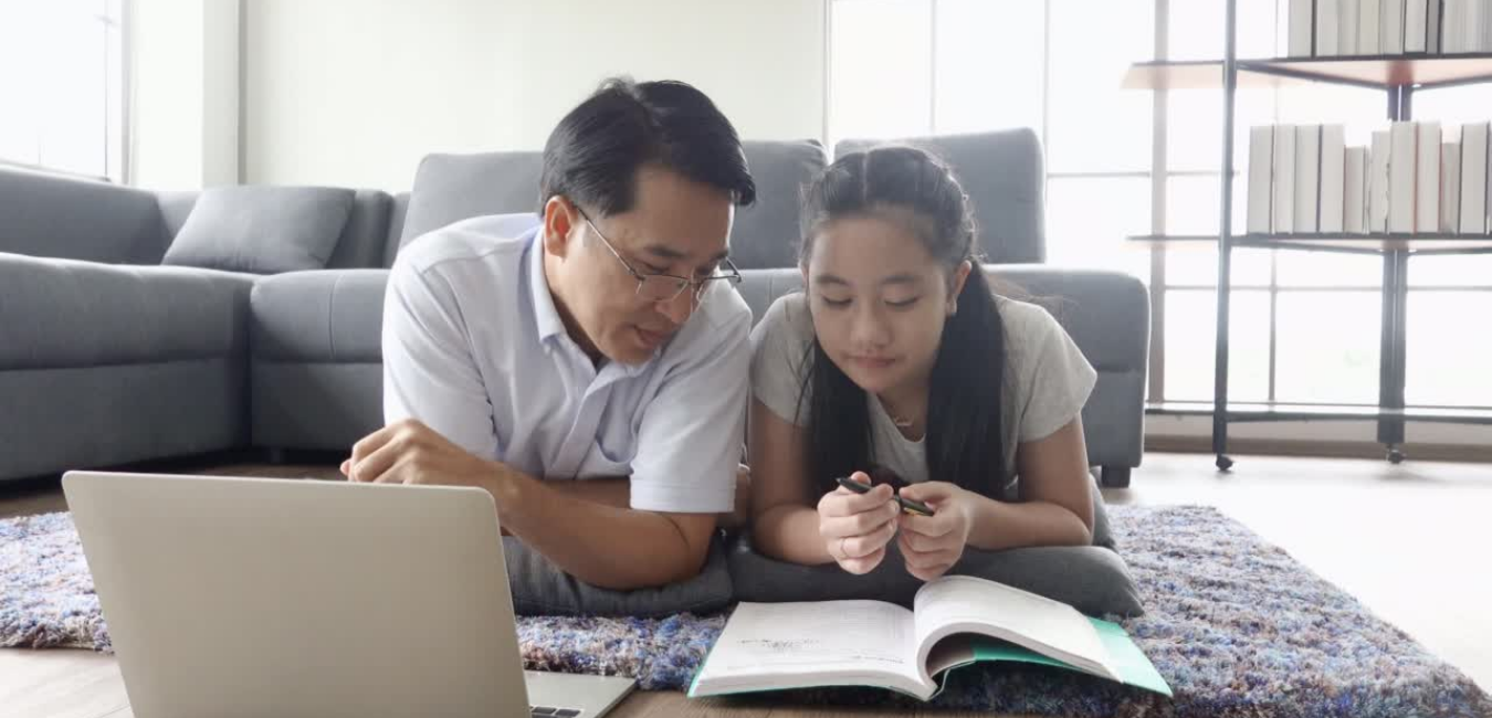 Asian father and daughter learning