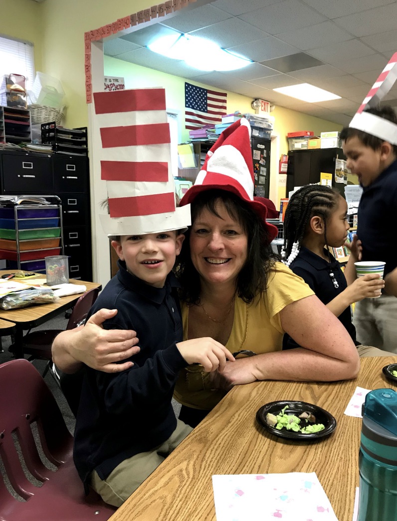 Teacher and student in Dr. Seuss hats