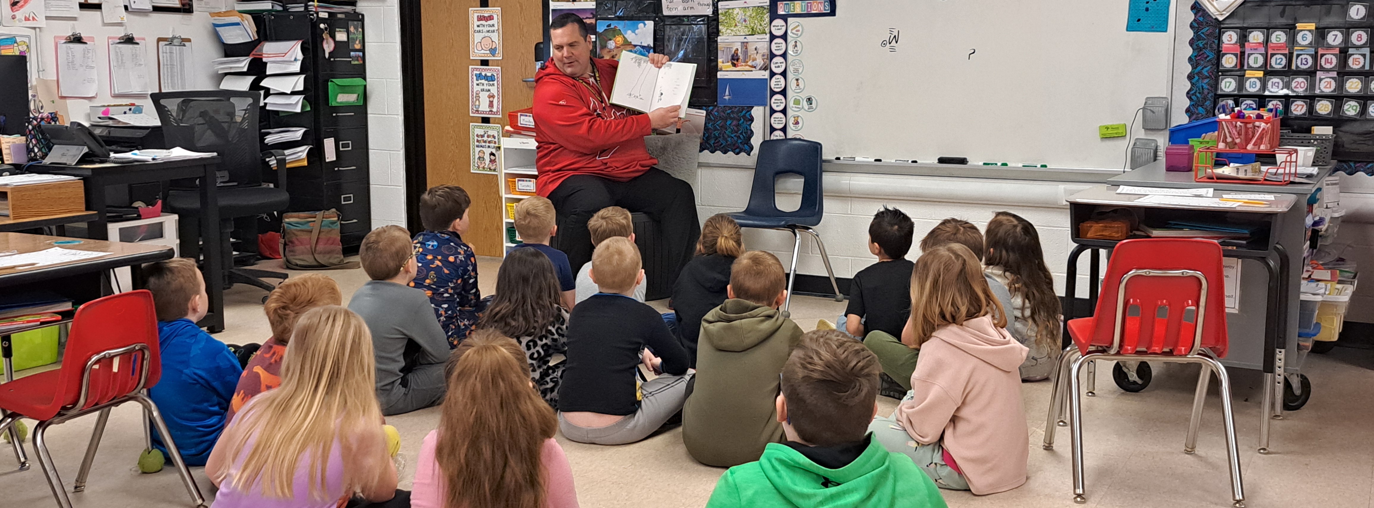 Superintendent Reading to Students