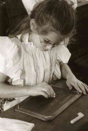 Girl writing in a board