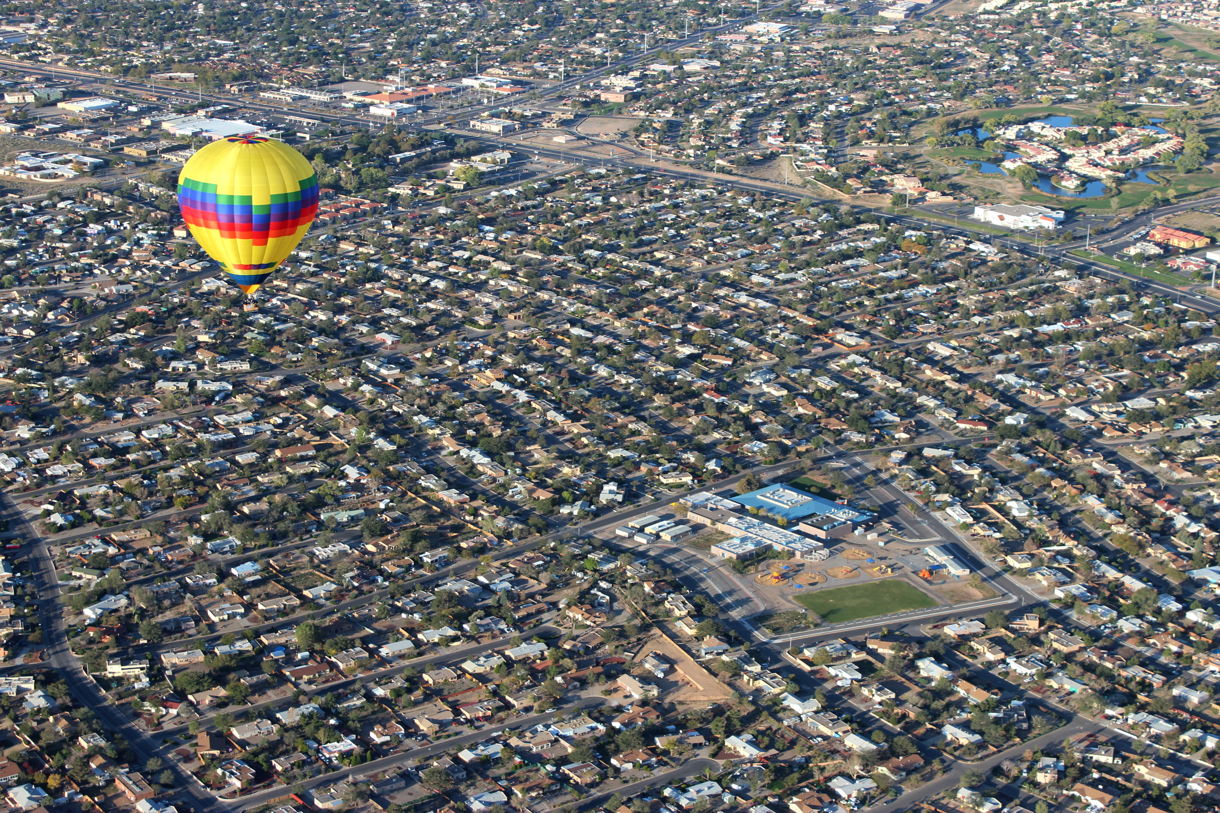 A hot air balloon flies over Rio Rancho Elementary School