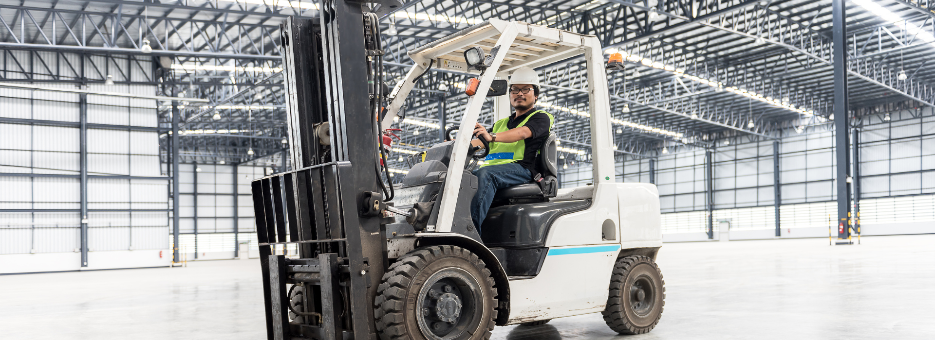 Man on a forklift in a warehouse