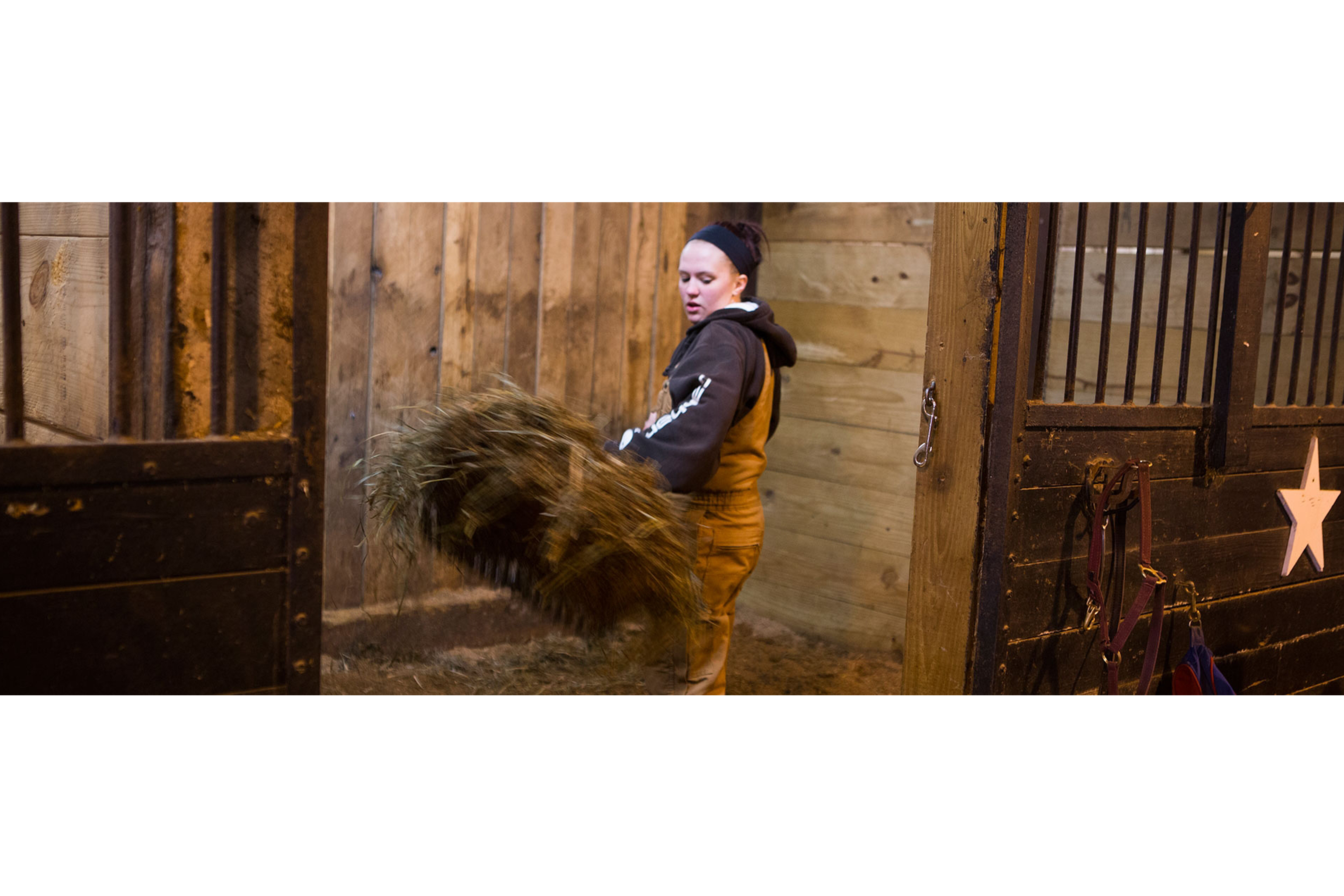  girl carrying straw