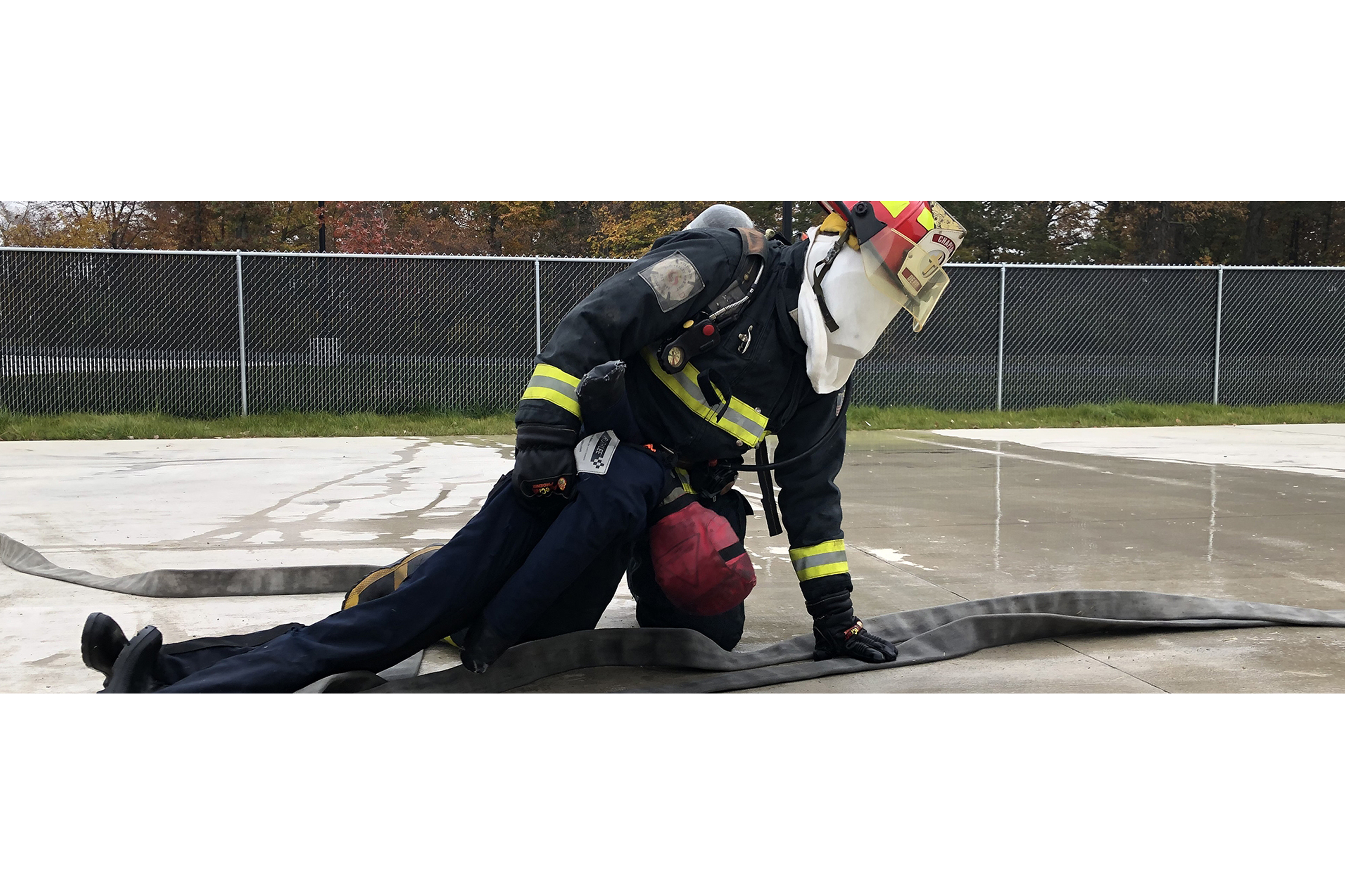 student fire fighter practicing rescues