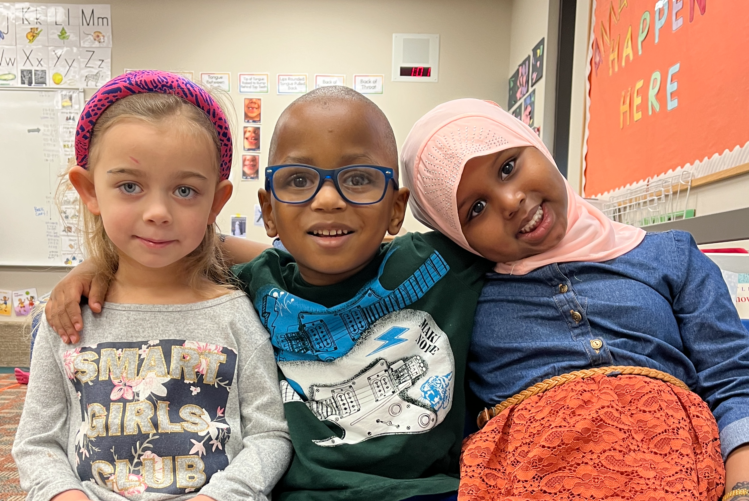 Three young students sitting together