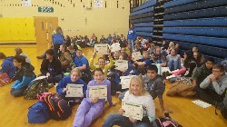Jr. High students showing off their Hour of Code Certificates
