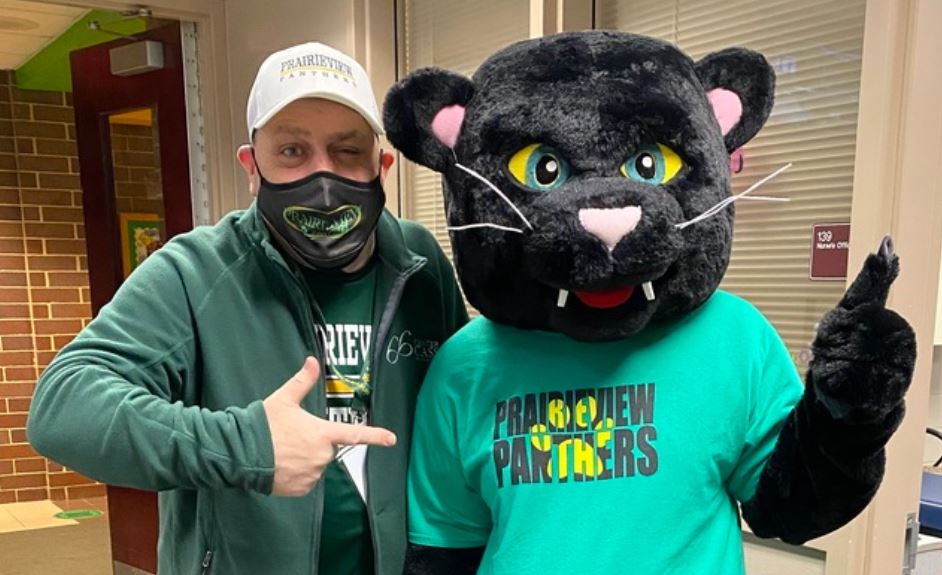 Mr. Pagel pointing at Prairieview panther mascot
