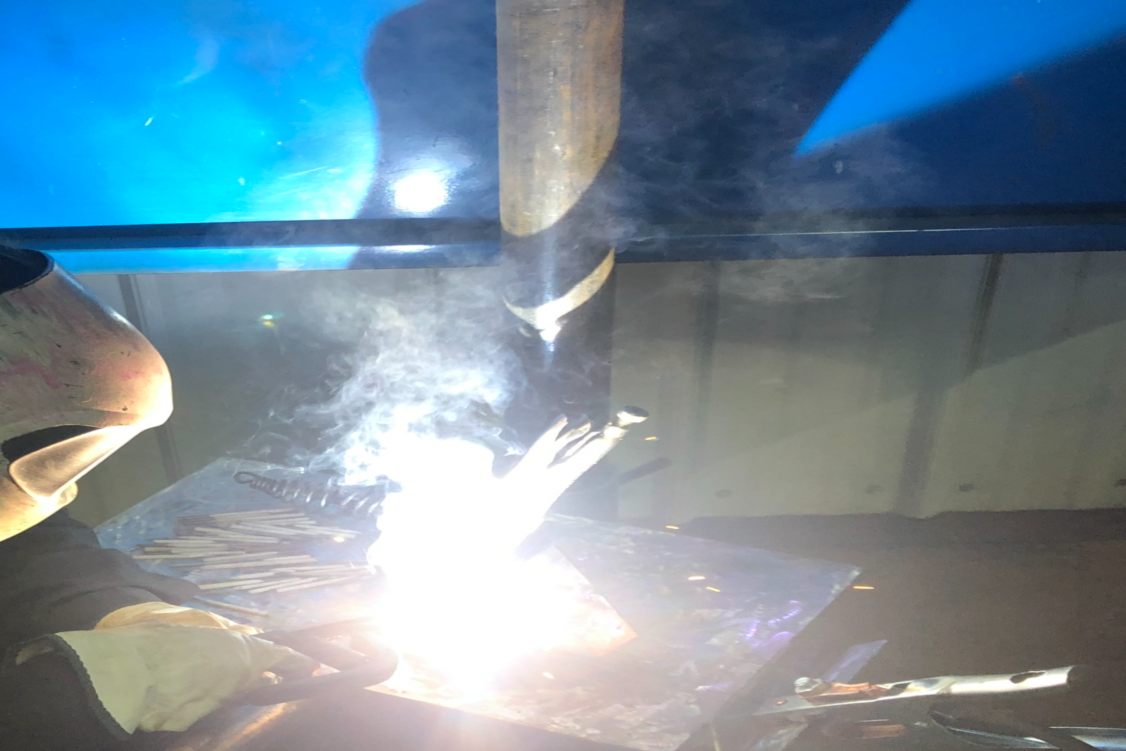 Female welder welding
