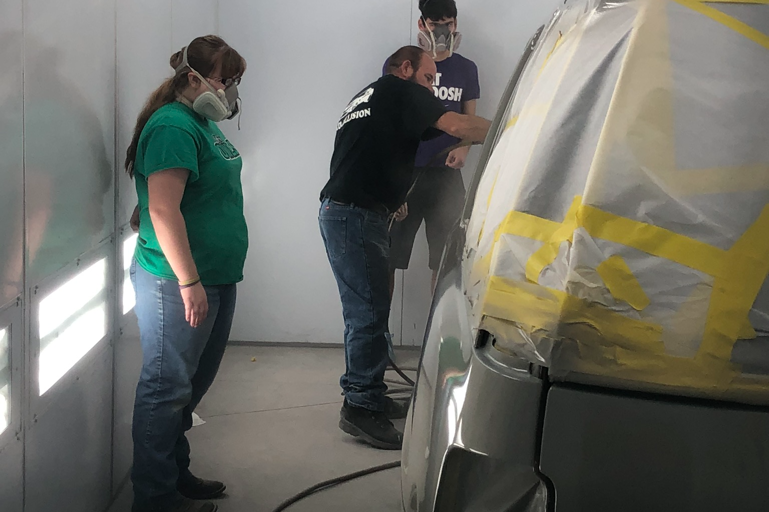 Auto Collision Instructor and students in the paint booth