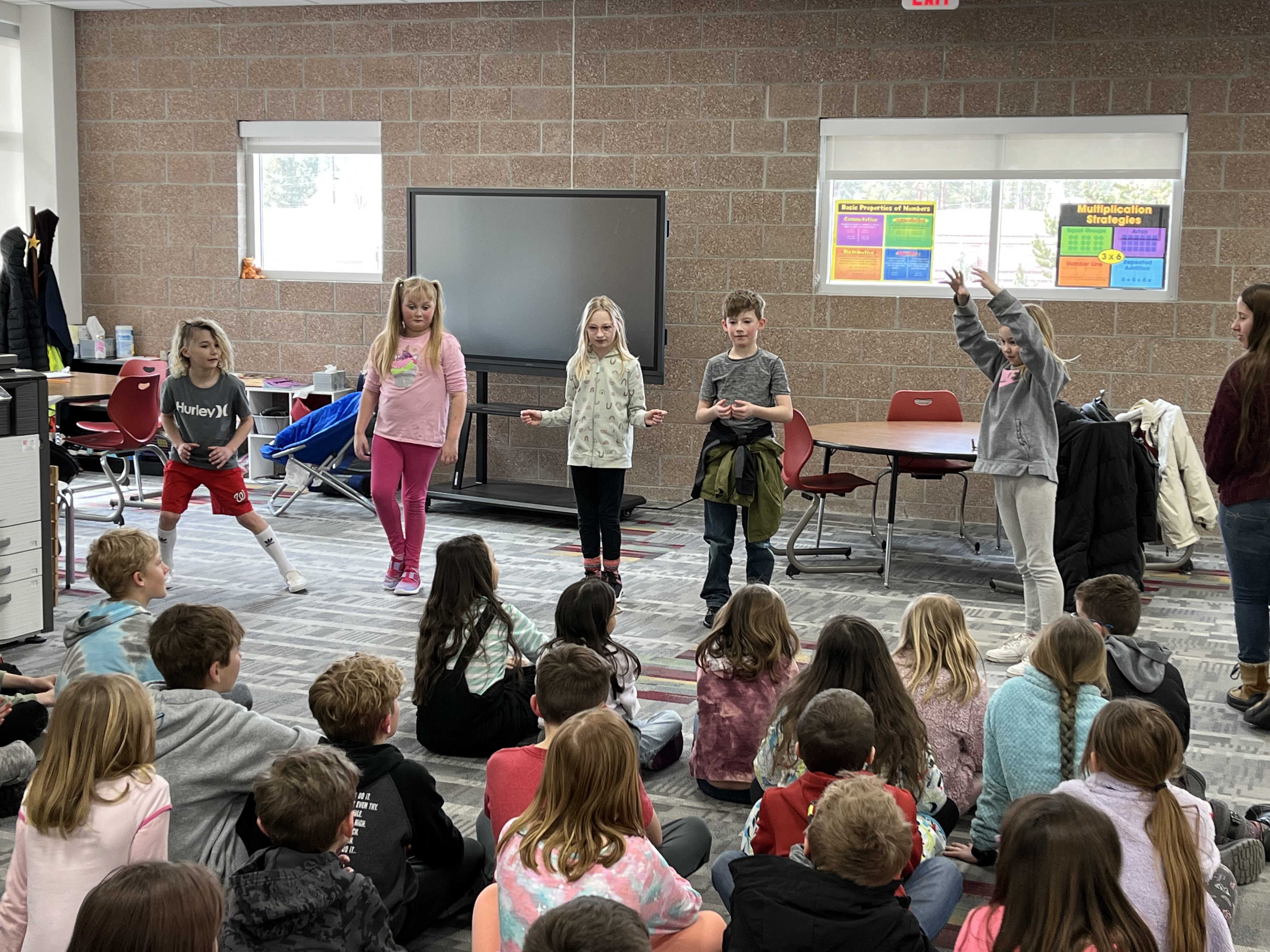 Students performing the show they learned from the presentation in front of an audience