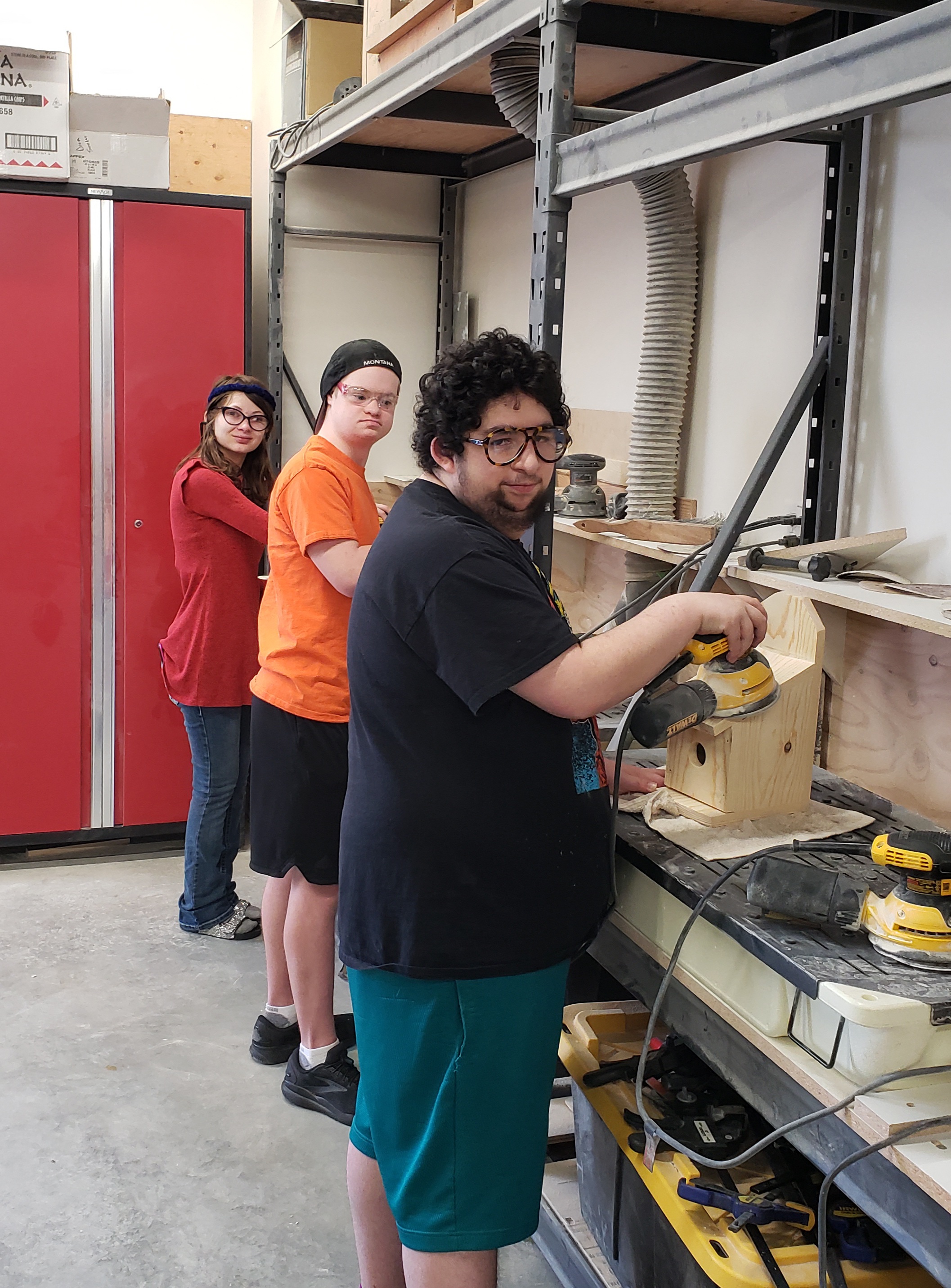 Charli, Carson and Gage working hard in shop class completing their birdhouse projects!