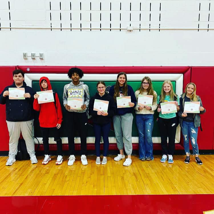 High School students with awards in the gymnasium