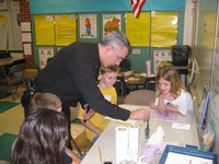 Avon Police Chief Mr. James Carney investigates the scene of the crime with Primary students.