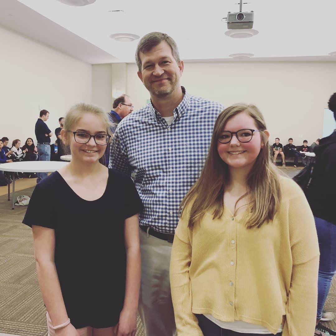 Dr. Shane Barnette, pictured with two students.