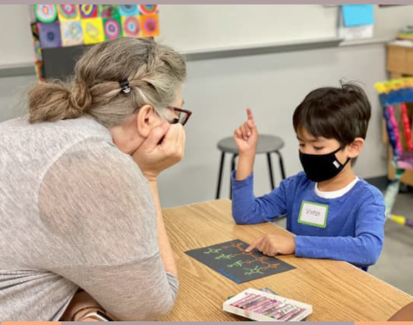 teacher with student