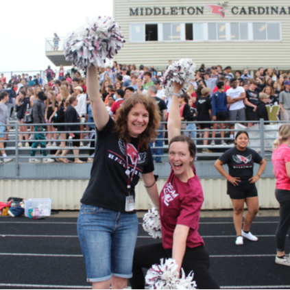 students with pom poms