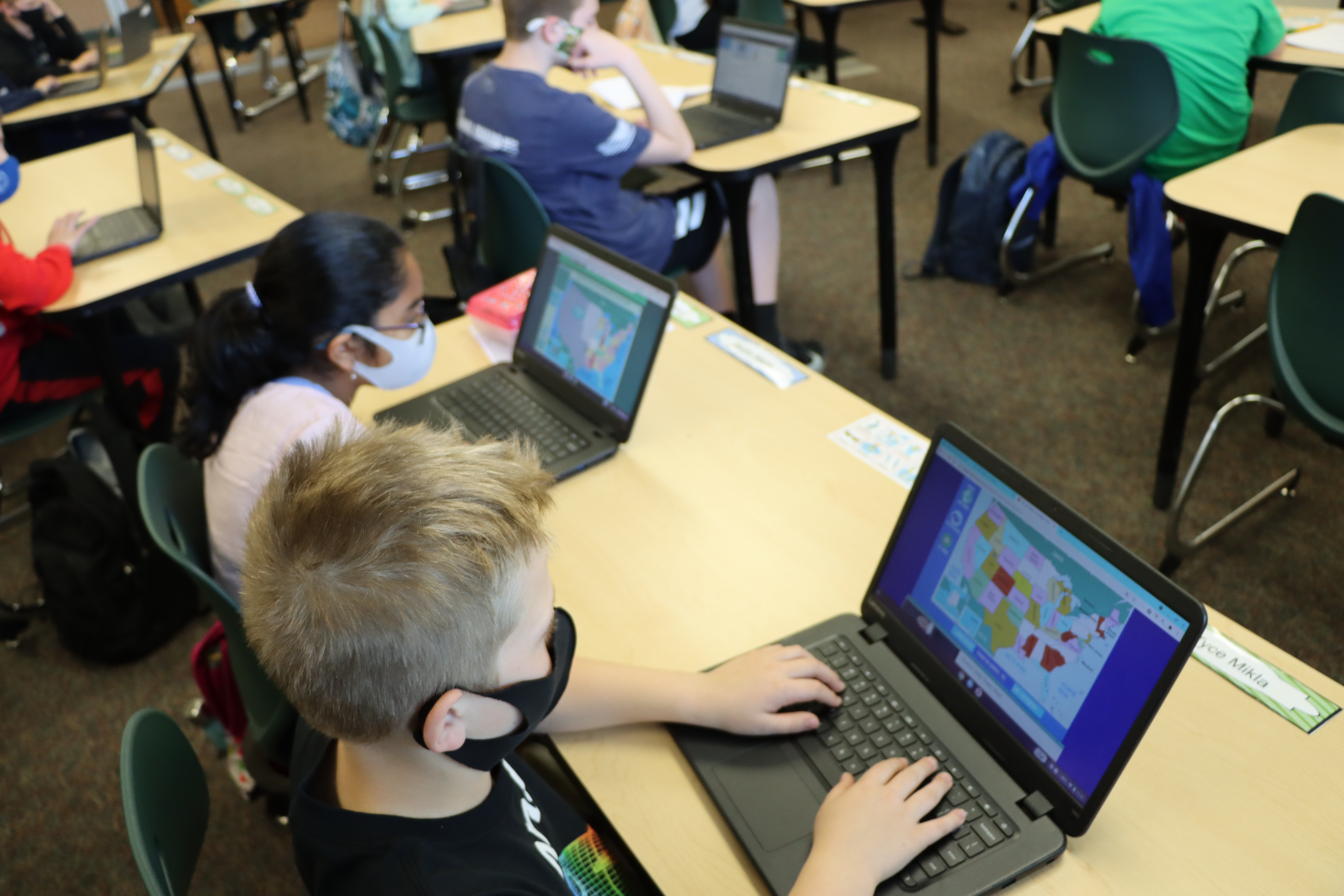 Students using Chromebooks in classroom