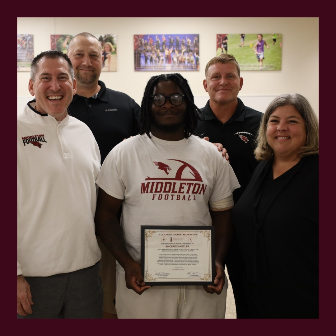 MCPASD staff members with student Sincere Dantzler and his Cardinal's Journey Award
