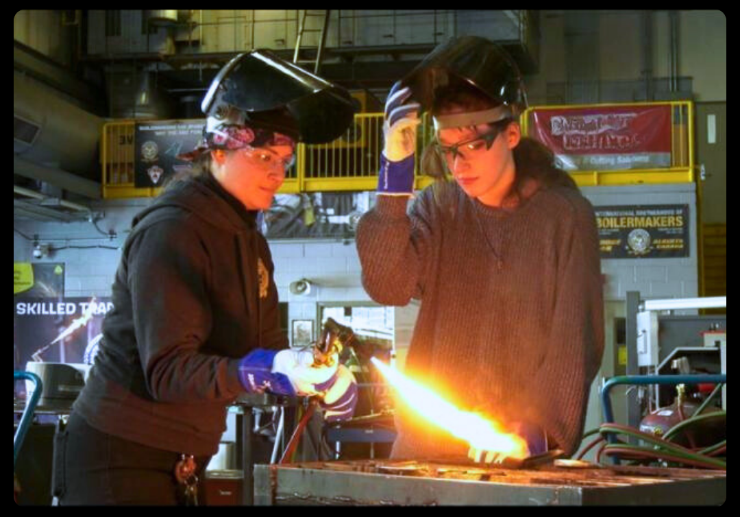 Two women welding