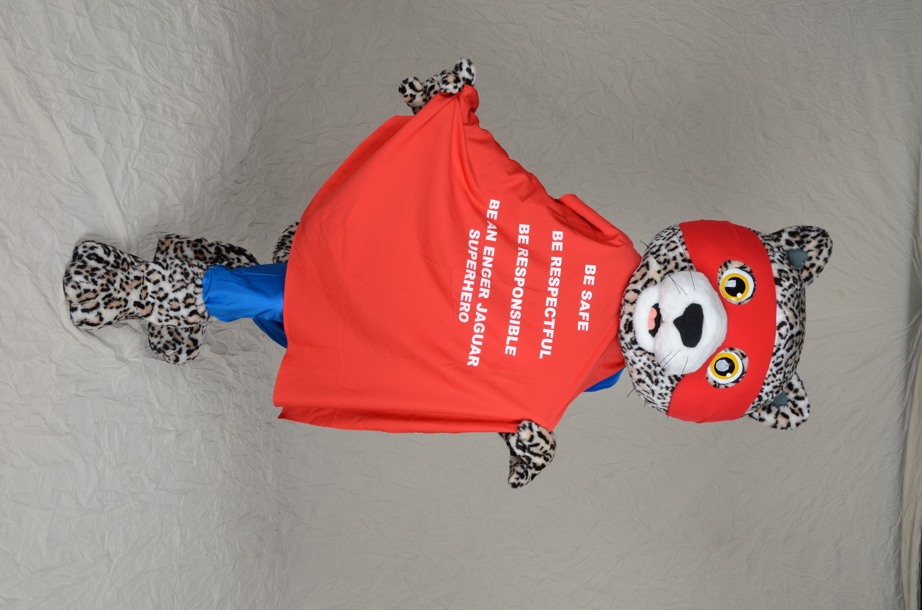 jaguar mascot with be safe, be respectful, be responsible written on his cape