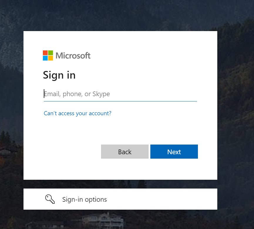 A Microsoft sign-in dialog box prompting the user to enter their email, phone, or Skype information. Below the input field are options to go back, proceed to the next step, access account recovery, and view additional sign-in options."