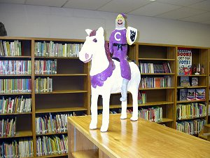 A virtual knight on a horse on a library shelf