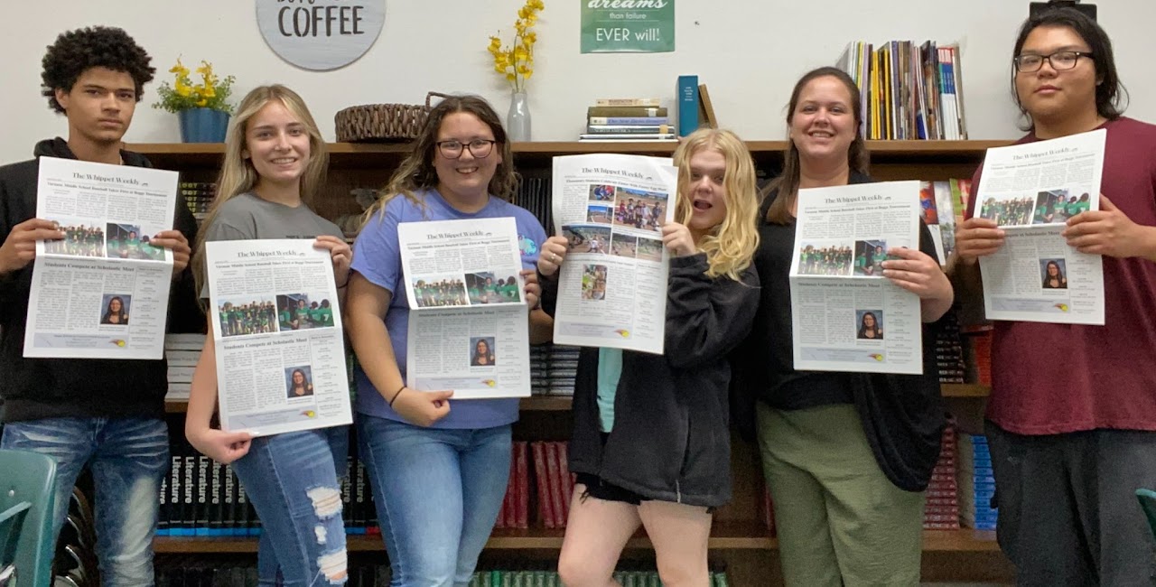 Our Journalism class holding up the first copies of The Whippet Weekly ever printed!