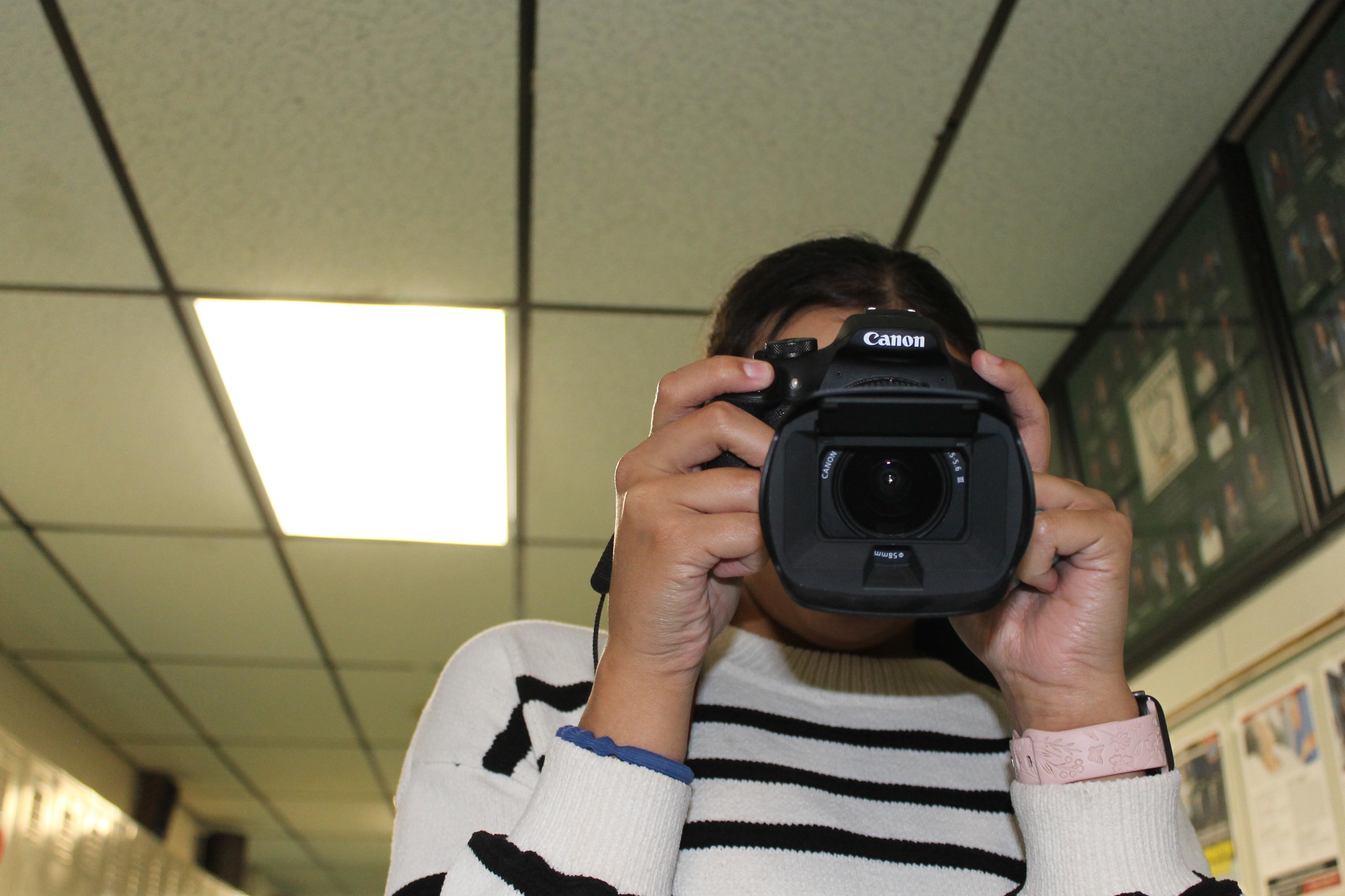 Freshman Madison Lewis camera at the ready. 