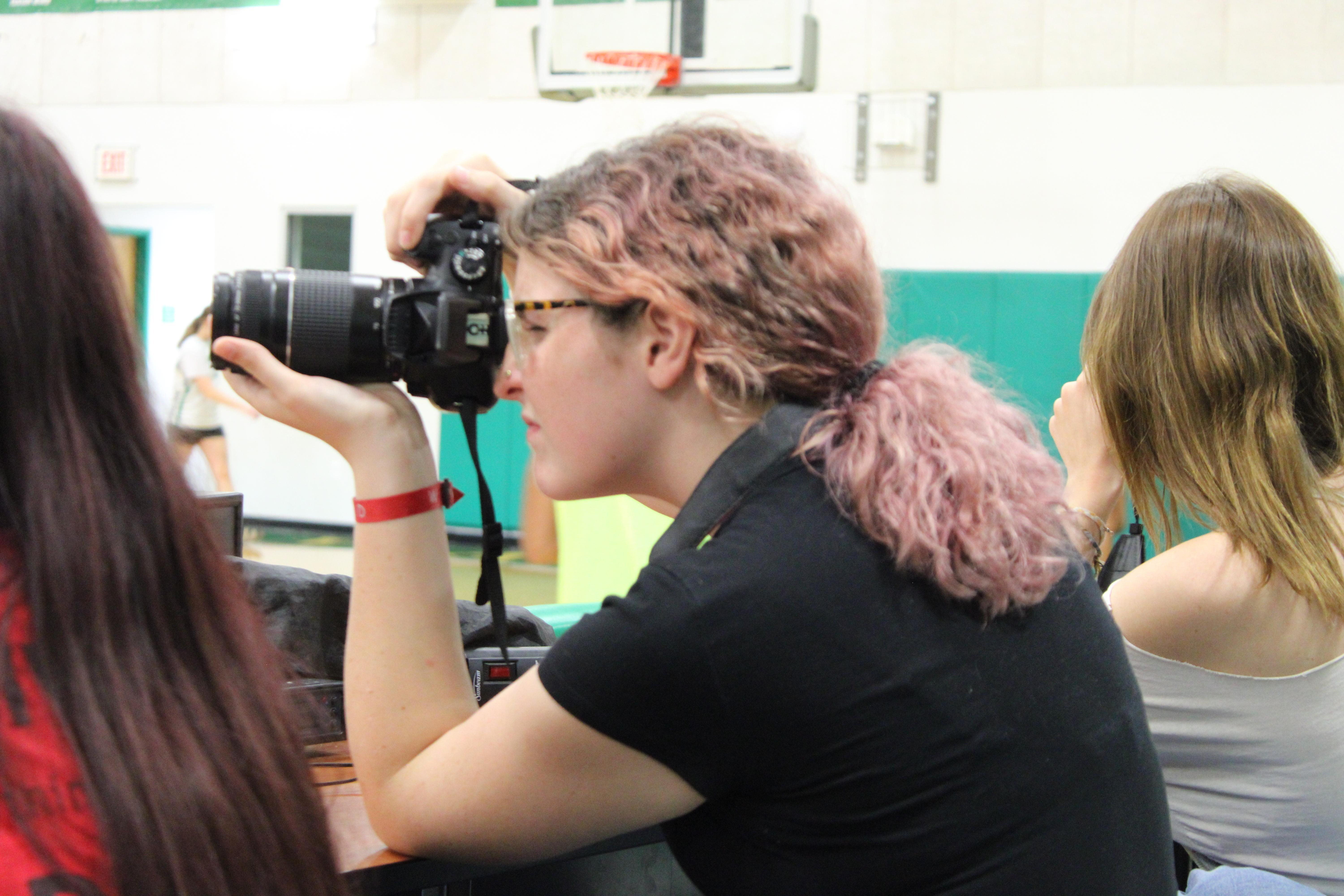 Staff Member Junior Maddyson Marson-Compton snapping candids at practice