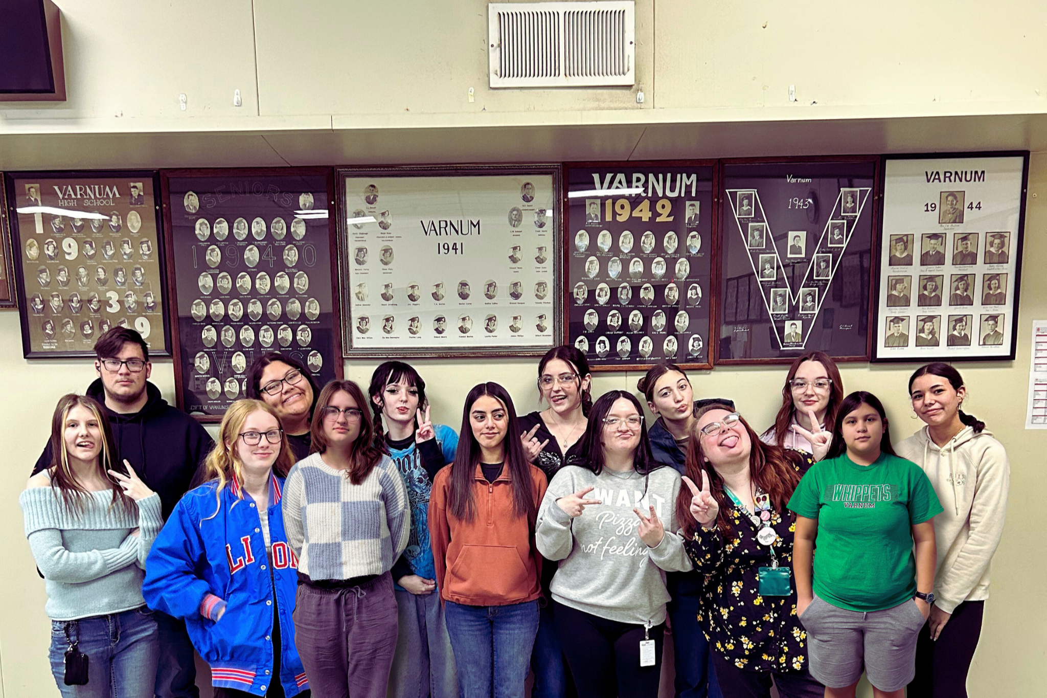 The Whippet Weekly staff being a little silly. From left to right back row: Sophomore Micheal McMillan, Junior Mvhayv "Baui" Salceda, Sophomore Raylee Blalock, Junior  Maddyson Marson-Compton, Sophomore Maddie Schatz, Junior Faith Cornett, and Freshman Madison Lewis. Front row: Senior Kursten Maxwell, Freshman Nevaeh Hare, Freshman  AJ Jones, Sophomore Dalia Marquez, Senior Editor and Junior Calora Cain,  Instructor and Editor Hanna Smith, and Freshman Izabelle Delarosa. Photograph by newest staff member Halie Dempsey