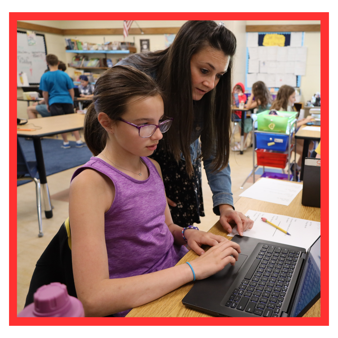 student with teacher over laptop