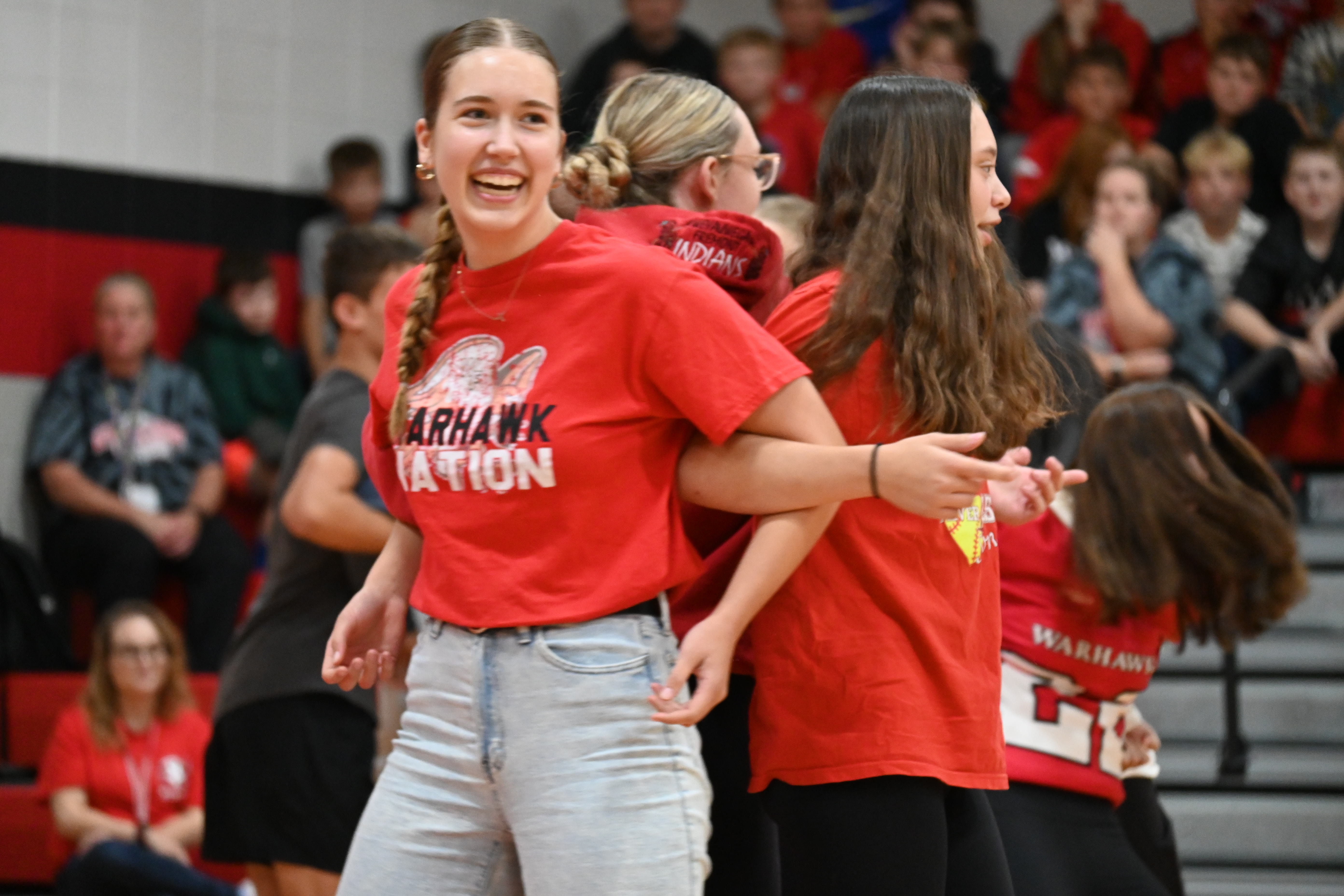 Students participating in homecoming pep assembly games.