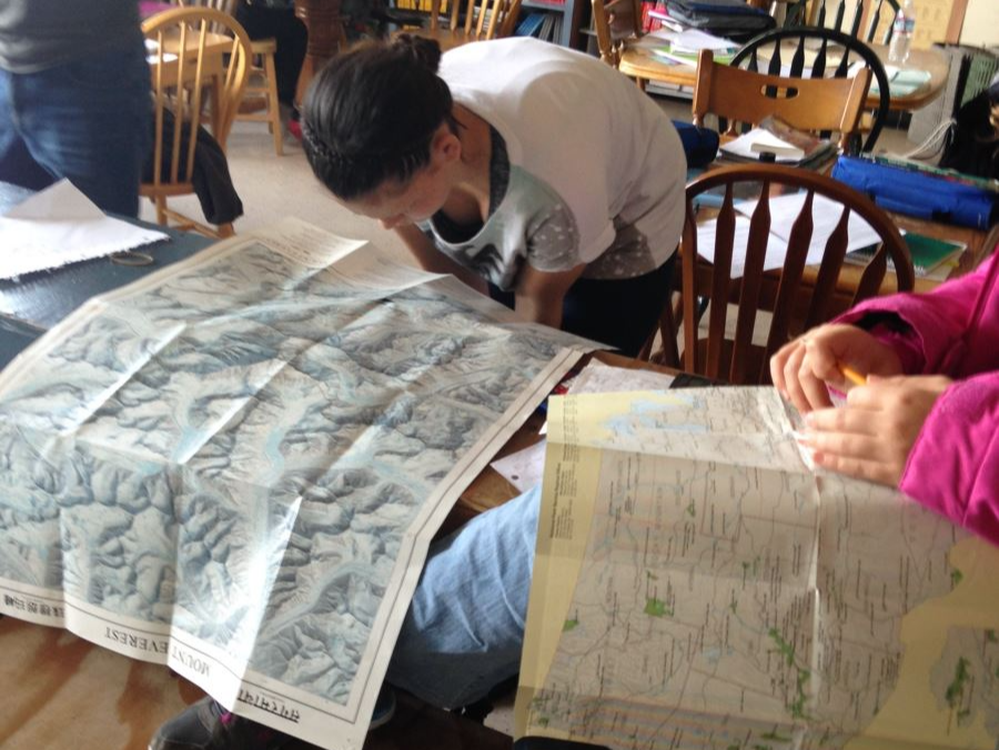 students reading a map