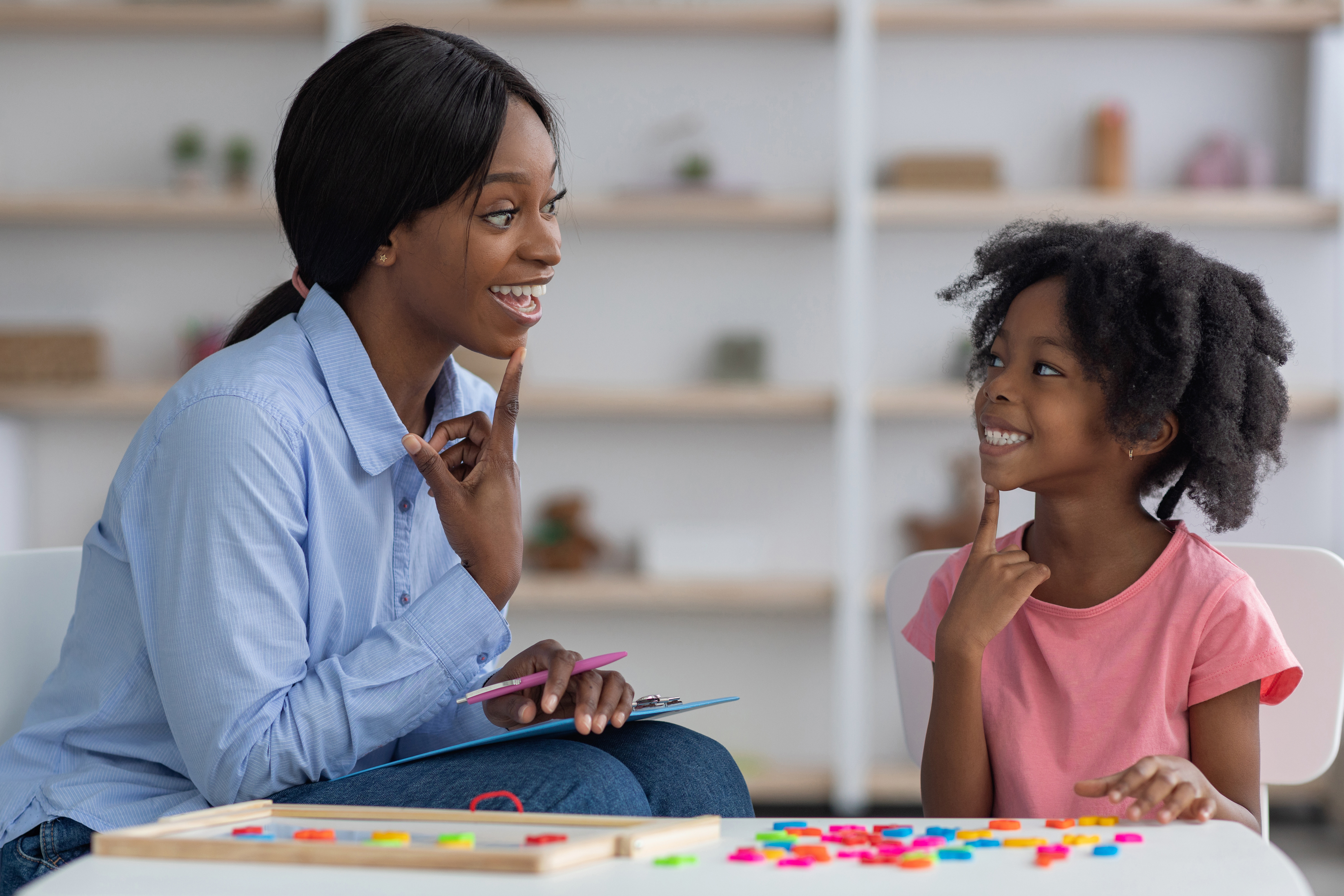 Speech therapist working with a child