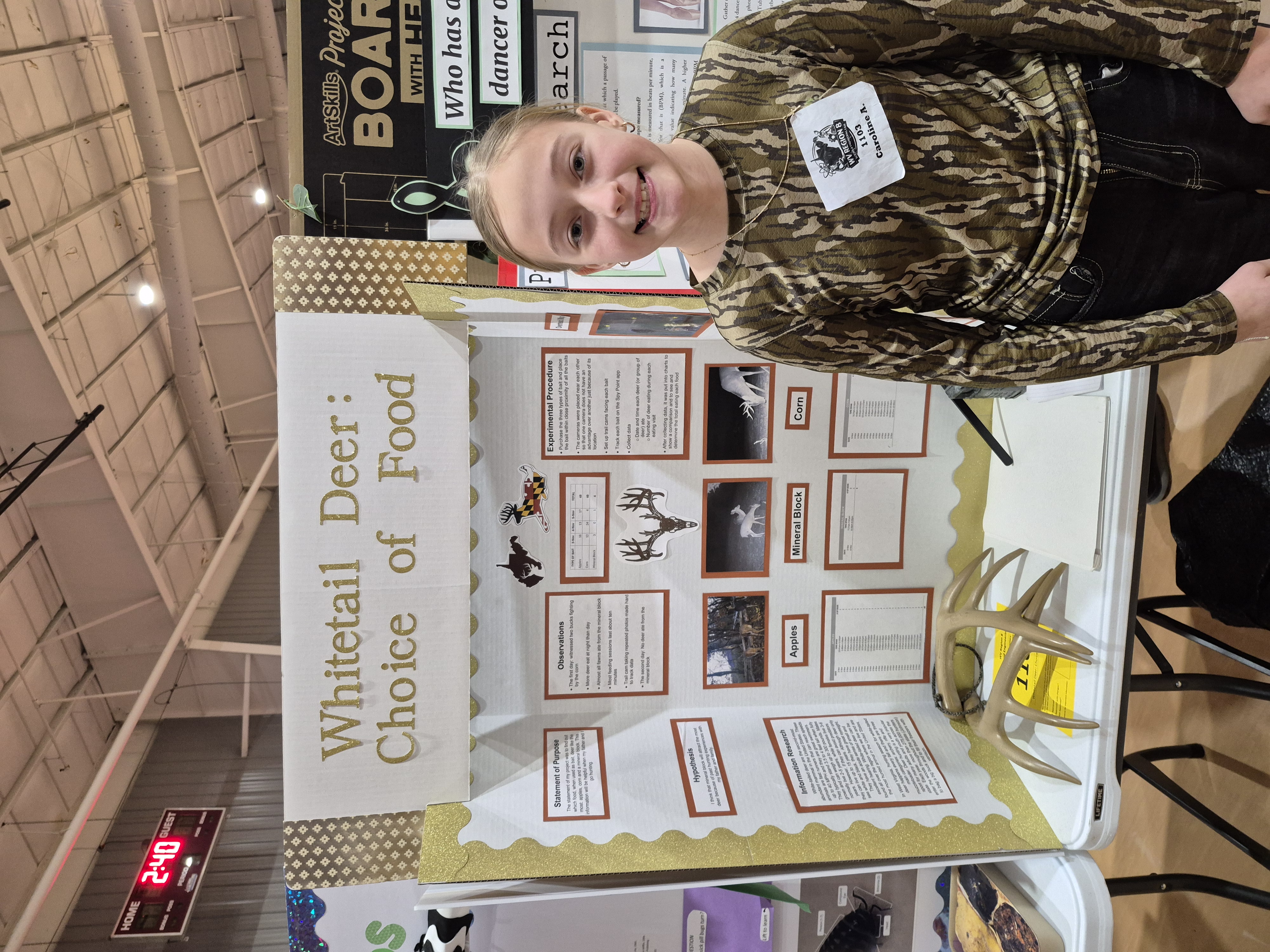 female student with science fair project board