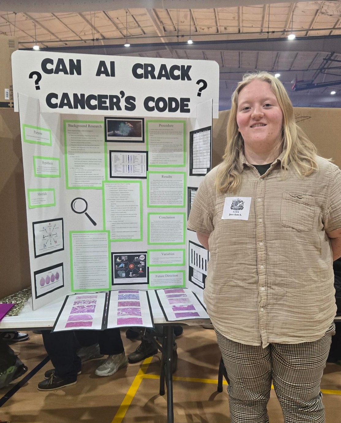 female student with science fair project board