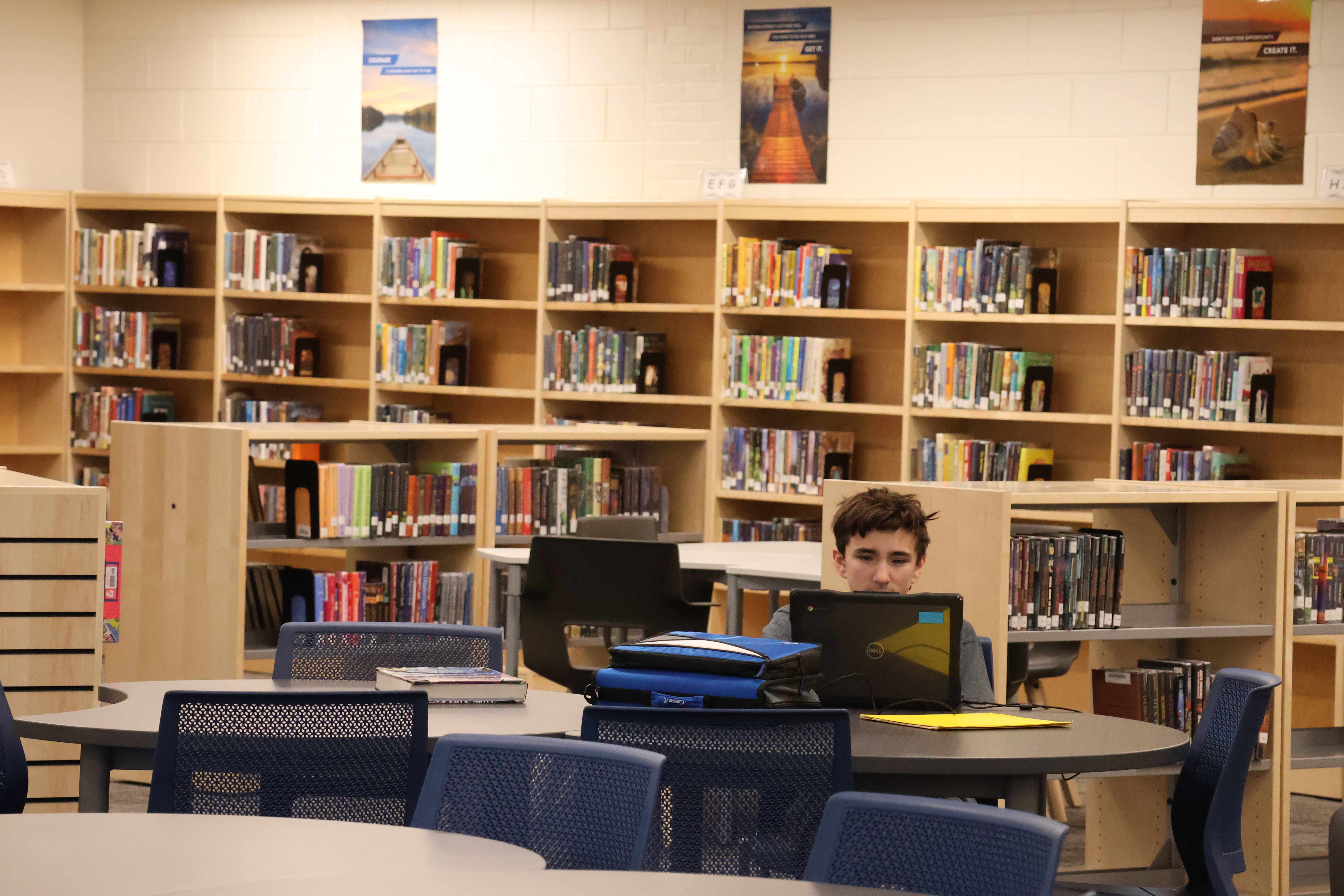 picture of student studying in media center at the middle school media center