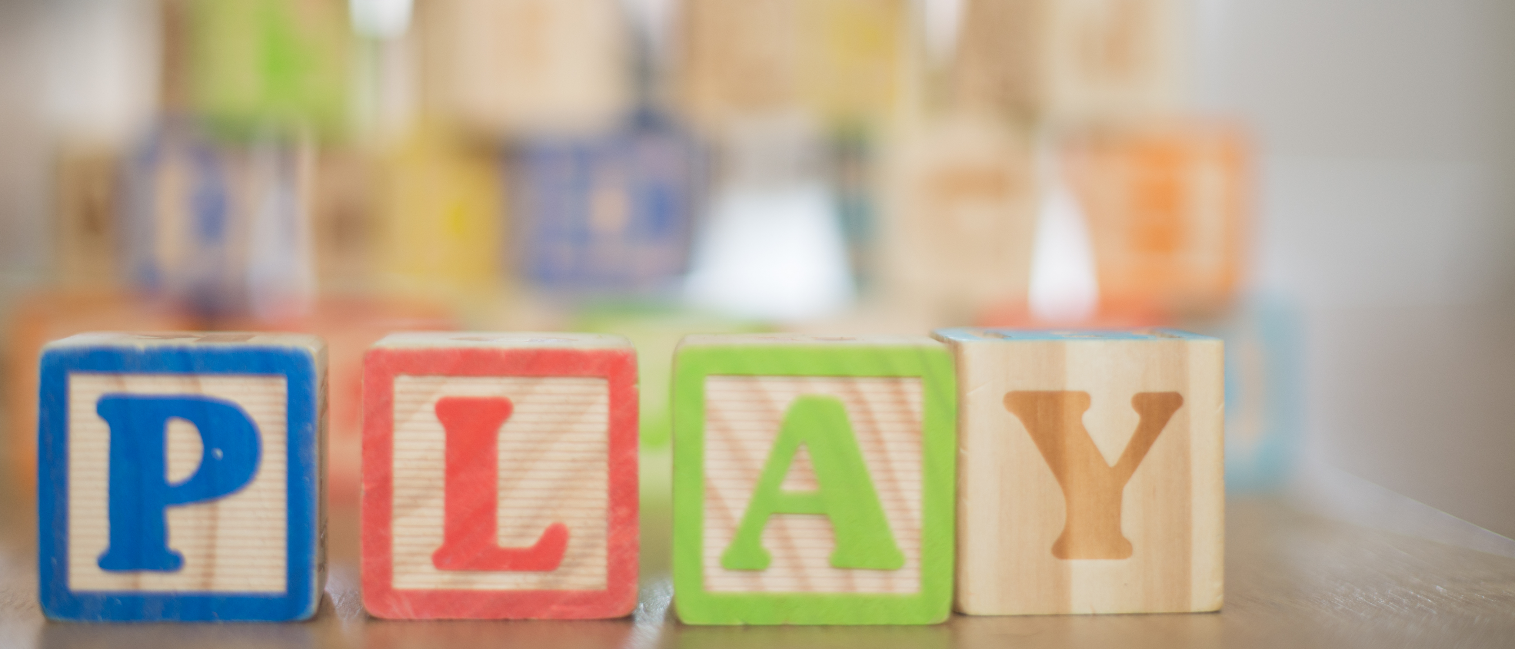 Wooden Blocks spelling the word "PLAY"