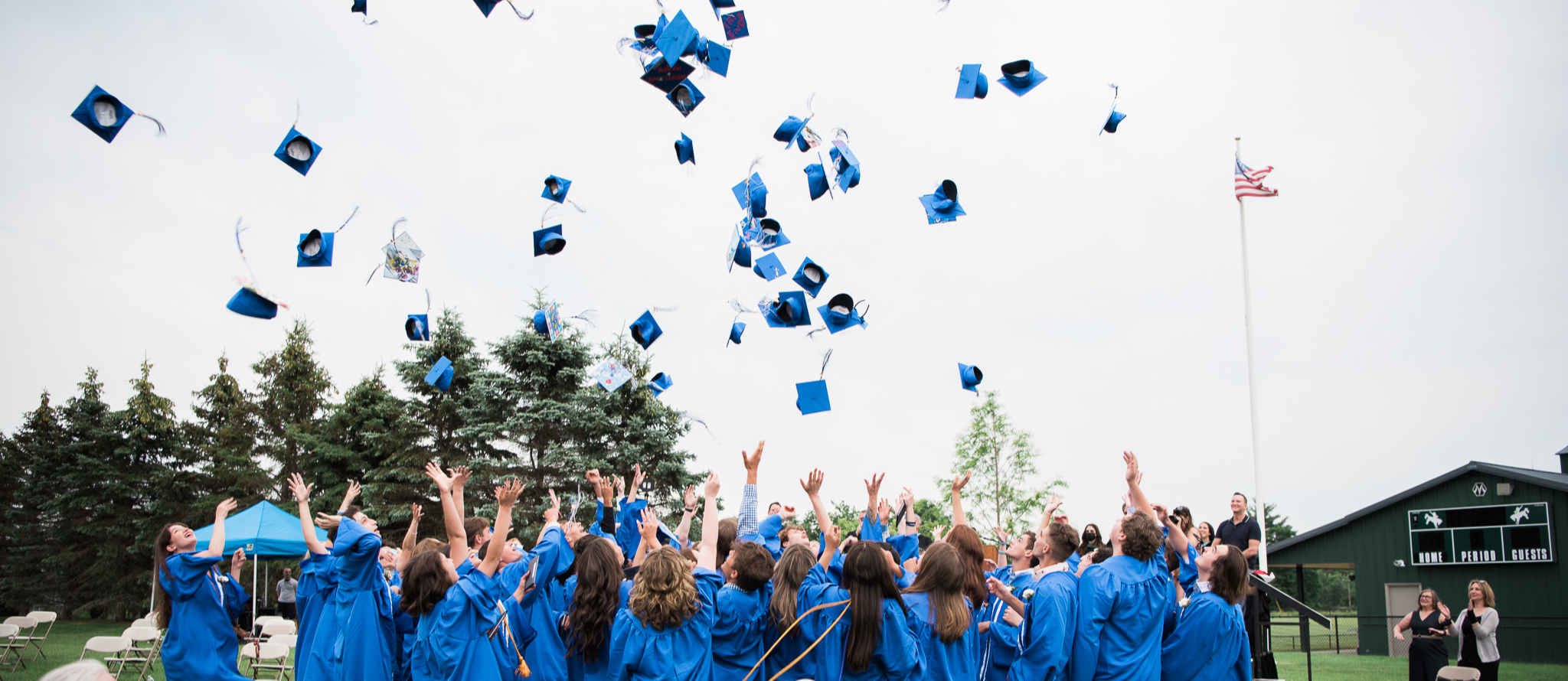 LPS Graduates throwing Caps in Air