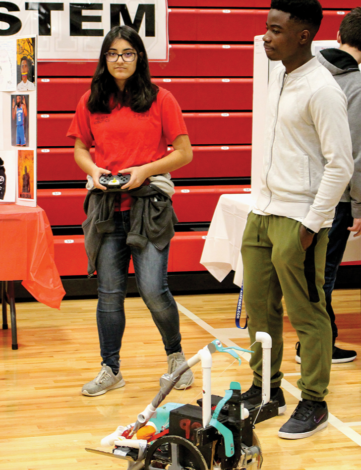 Robotics students show their robot at the Melissa High School Academic Expo