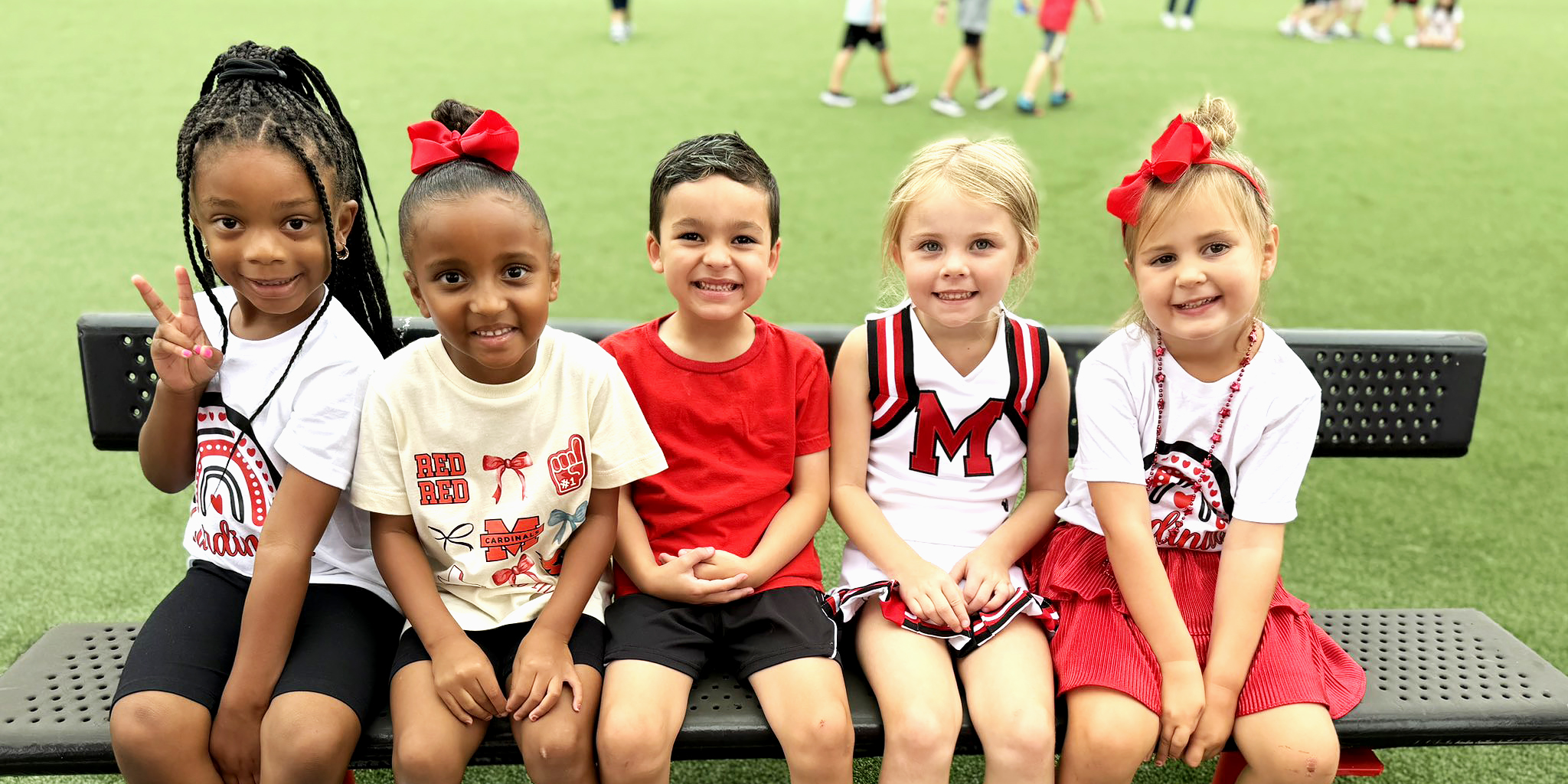 Young Cardinals on a bench