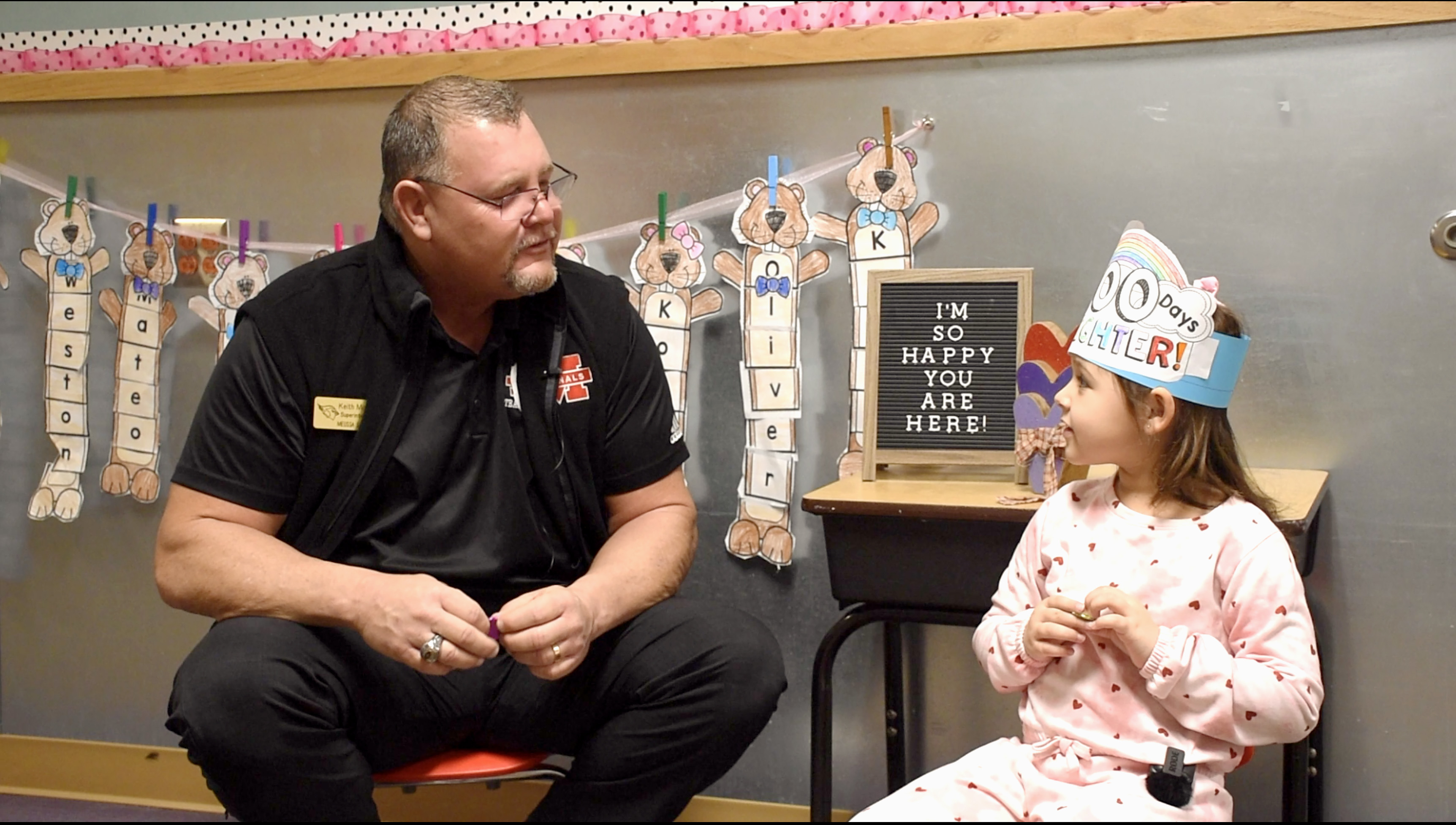 Mr Murphy Speaking with Elementary Student
