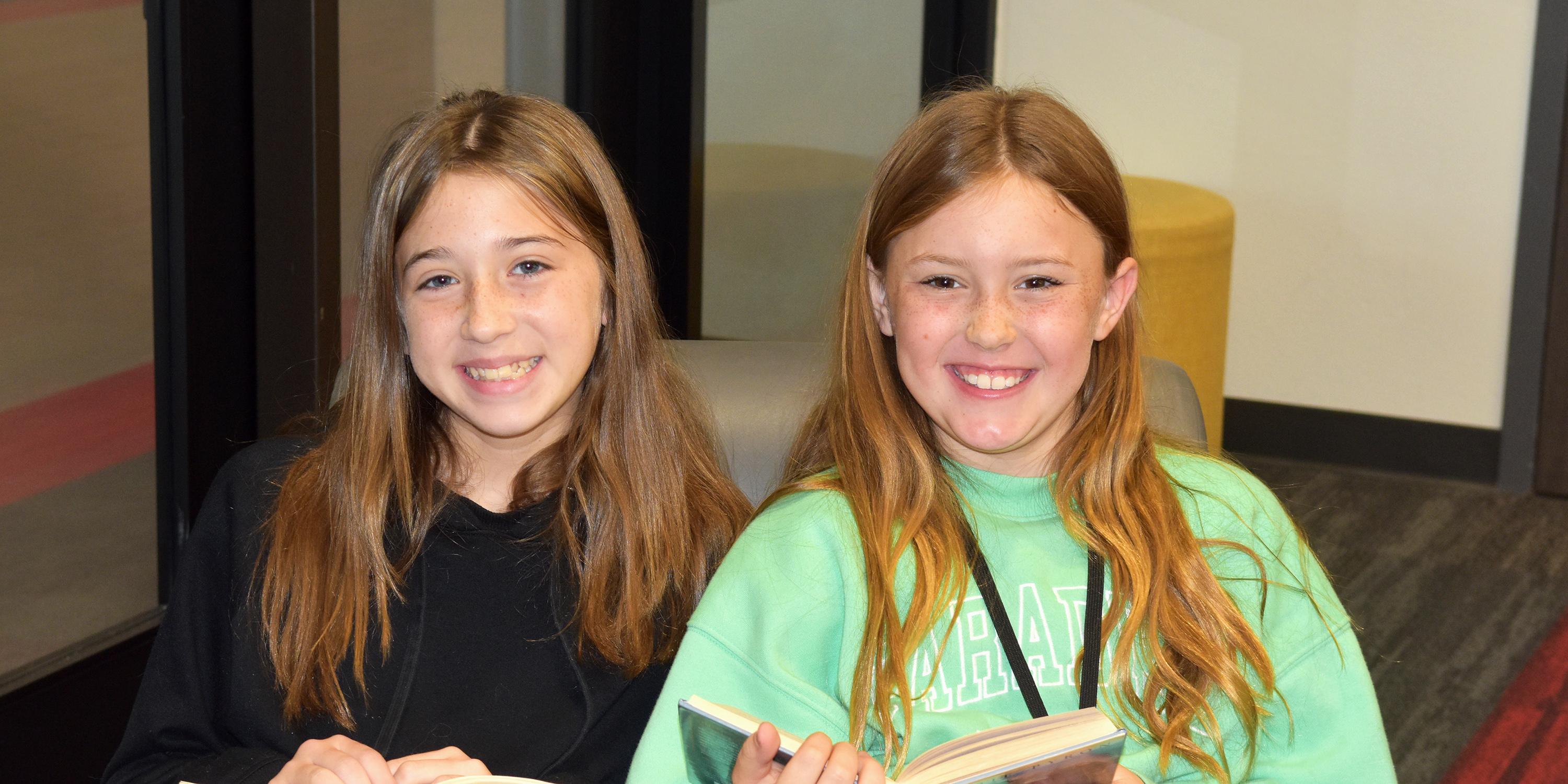 Friends sitting in the library