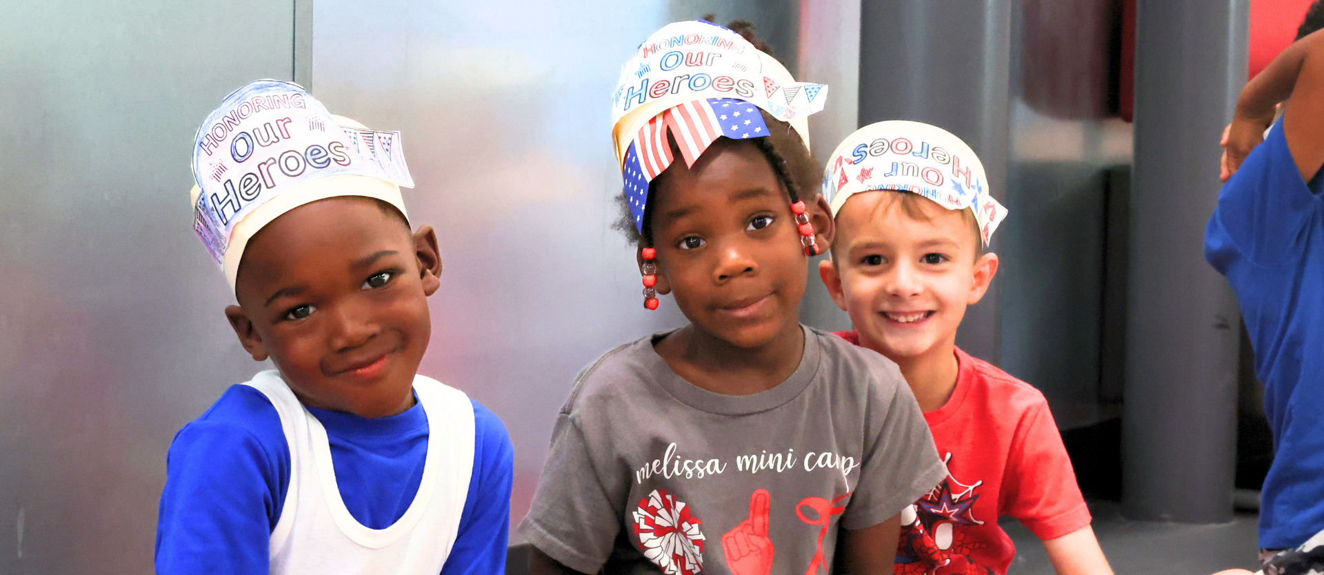 NCE Students in the hallway smiling during First Responders Parade
