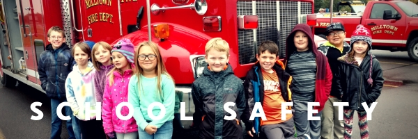 photo of students in front of a firetruck that says "school safety"