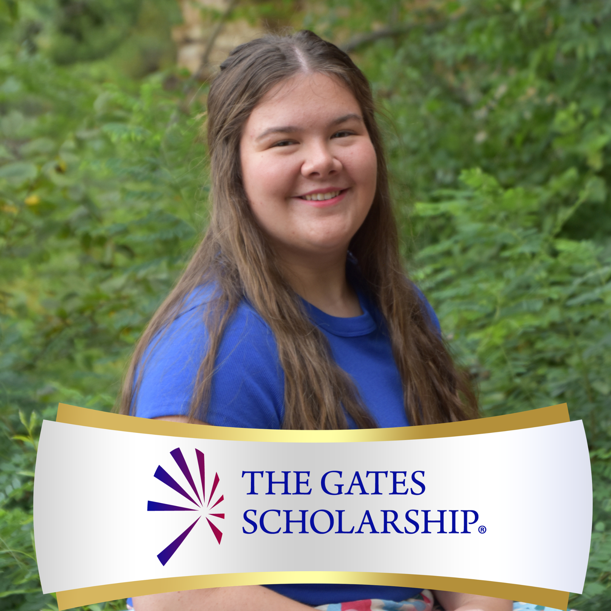 A smiling female student in a blue top stands outside in front of green foliage, with a banner overlay across her chest that reads "The Gates Scholarship."