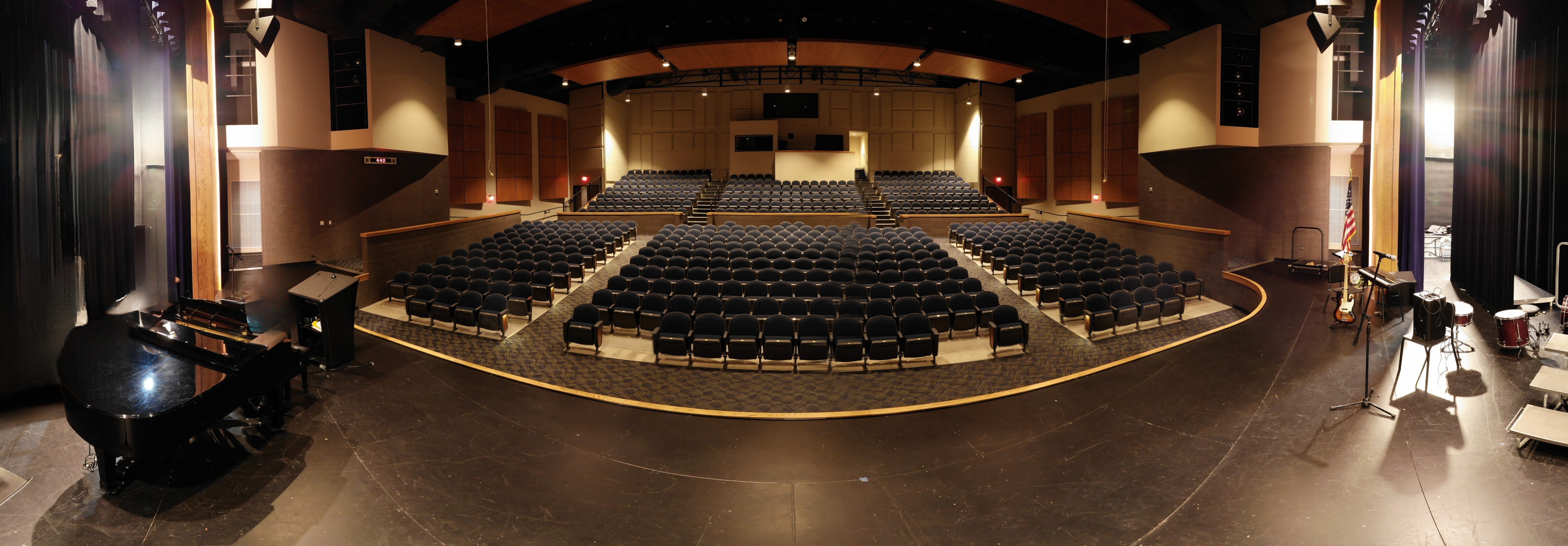 panogramic picture of the Unity Performing Arts Center lookin from the stage into the seating area