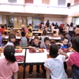 Elementary students at lunch in the multi-purpose room