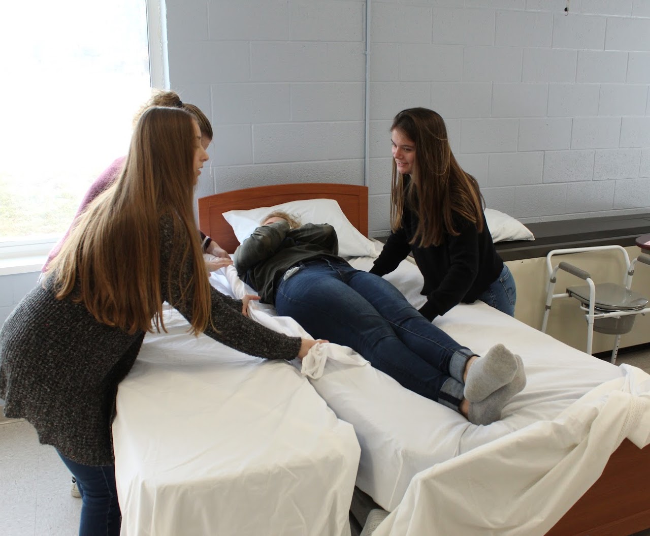 Medical Assisting Students practicing with a patience